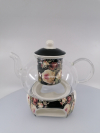 Sklenený čajník s porcelánovým ohrievadlom na motív ruží na čiernom podklade